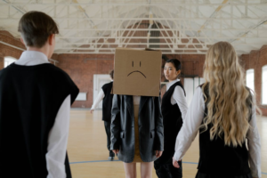 A person wearing a cardboard box over their head