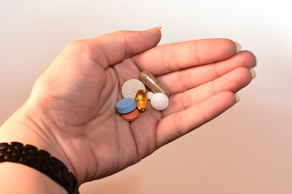 A person holding pills