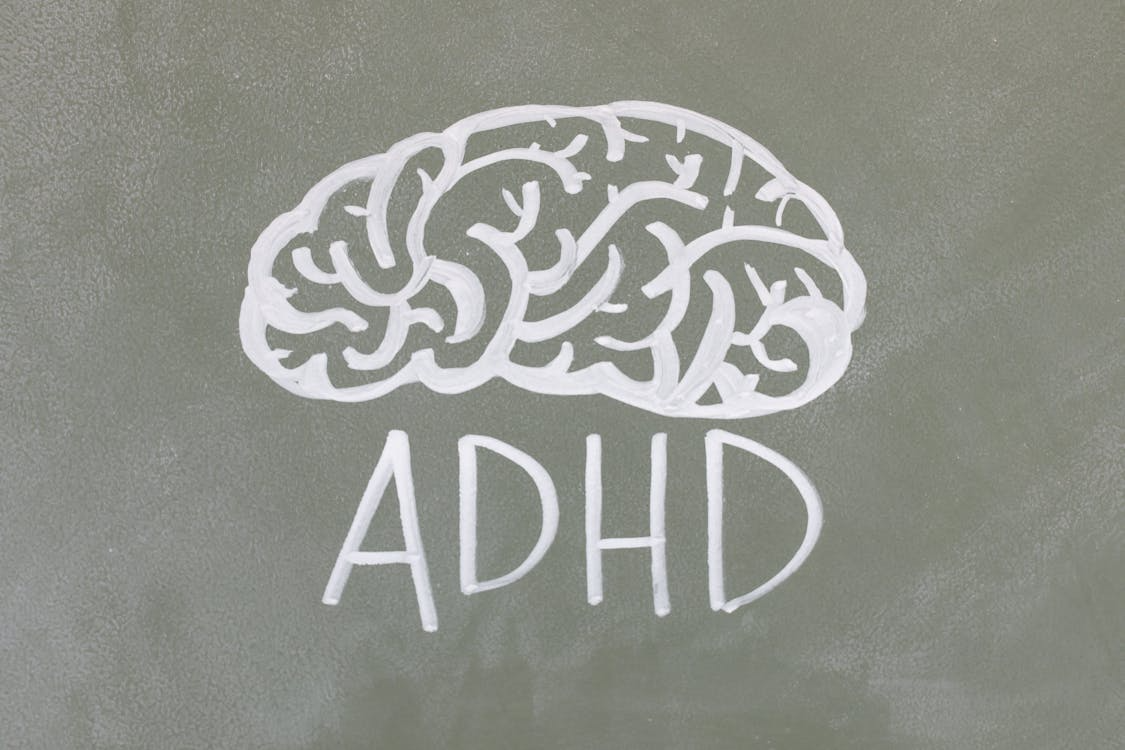 An ADHD illustration on a chalkboard