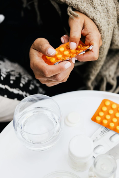 A woman taking medication for panic disorders.