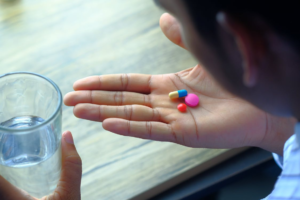 A person taking pills