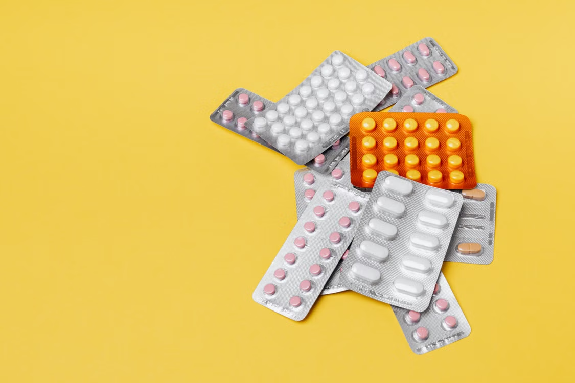 Close-up of various colorful pills in blister packs